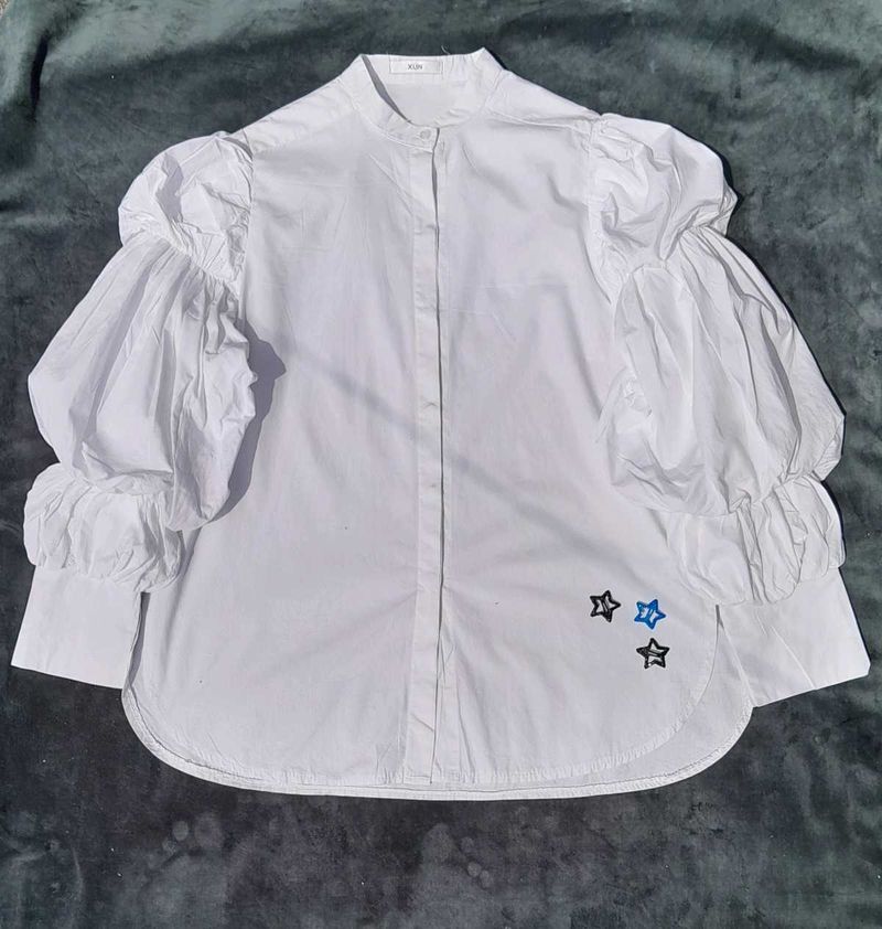 White balloon-sleeve shirt.