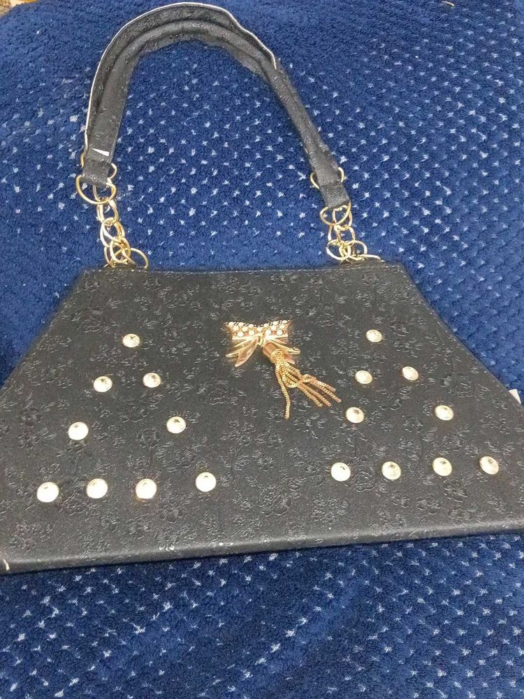 Chic Black Handbag with Bow Detail