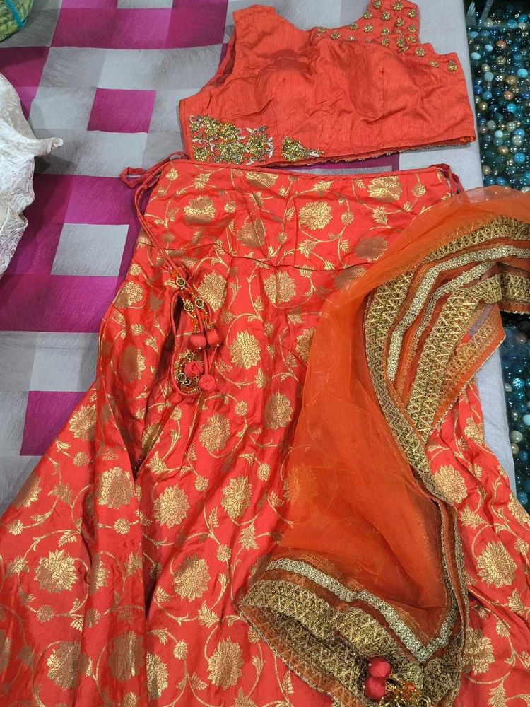 Stunning Orange Lehenga Choli with Gold Floral