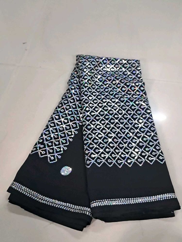 Elegant Black Saree with Silver Embellishments