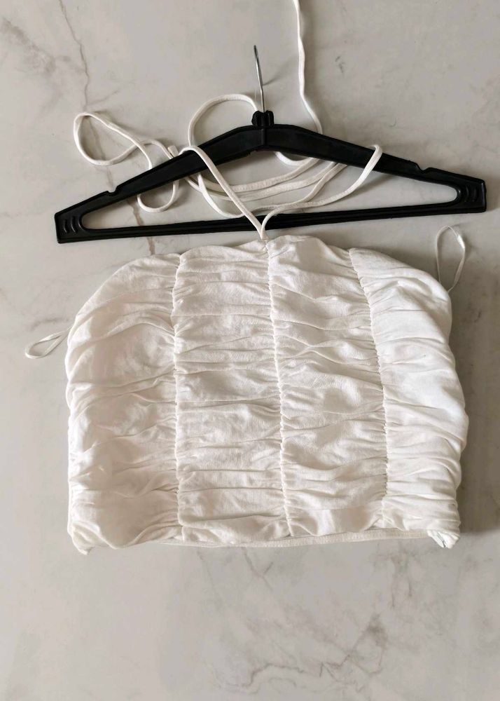 White sleeveless top