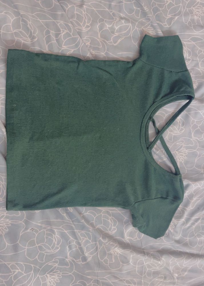 Green top with criss cross design on back