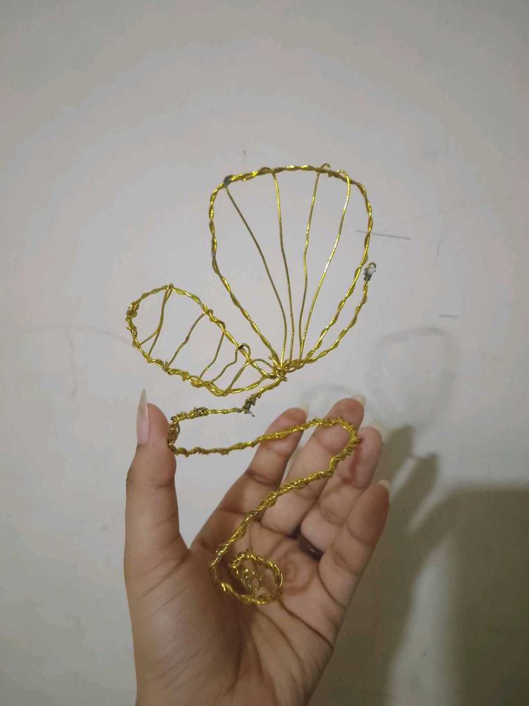 Golden Butterfly Wire arm cuffs.
