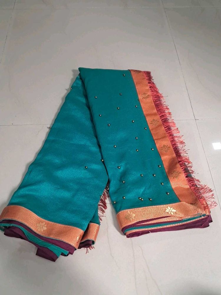 Elegant Teal Saree with Golden Border