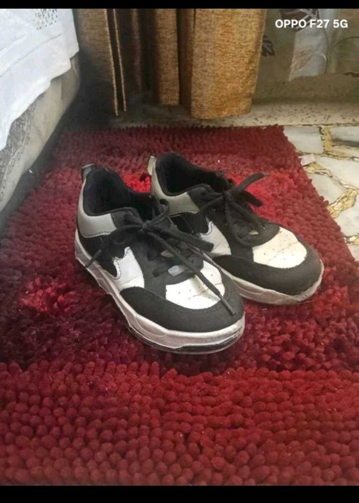 7. BOYs Black and White Sneakers