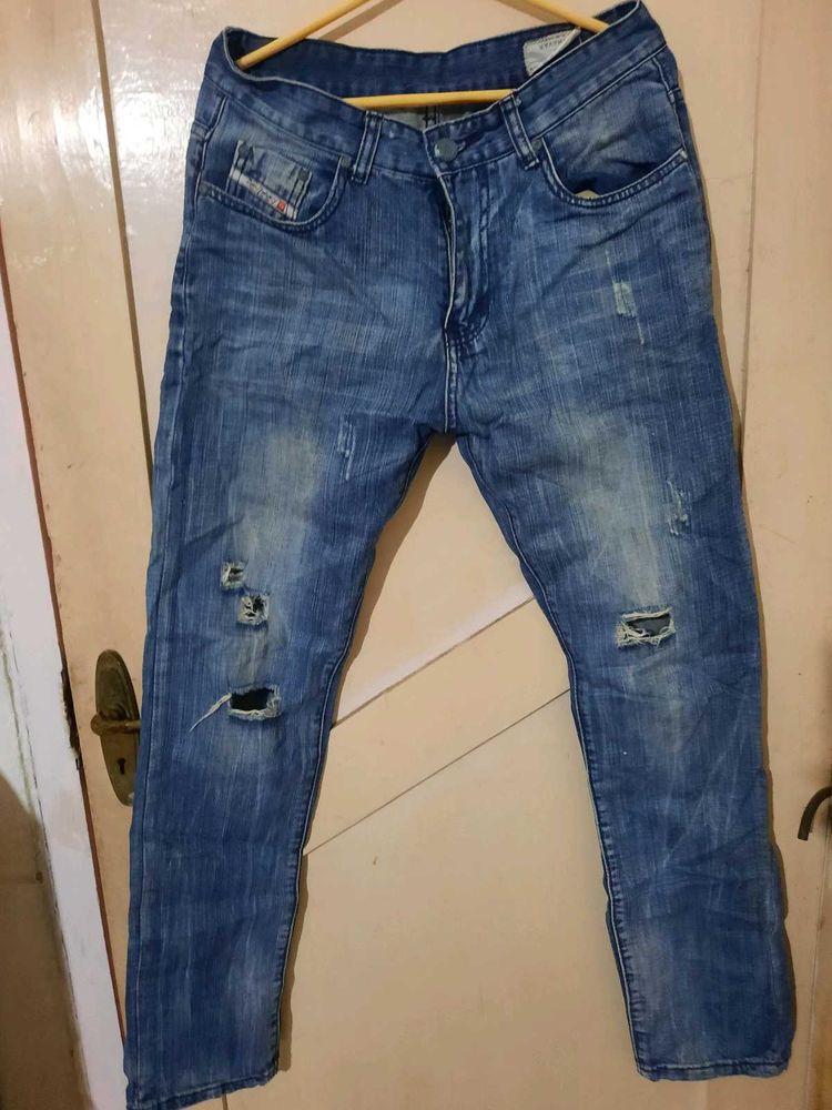 2 numbers of Distressed Blue Jeans