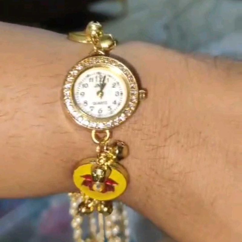 Elegant Gold Watch with Charms