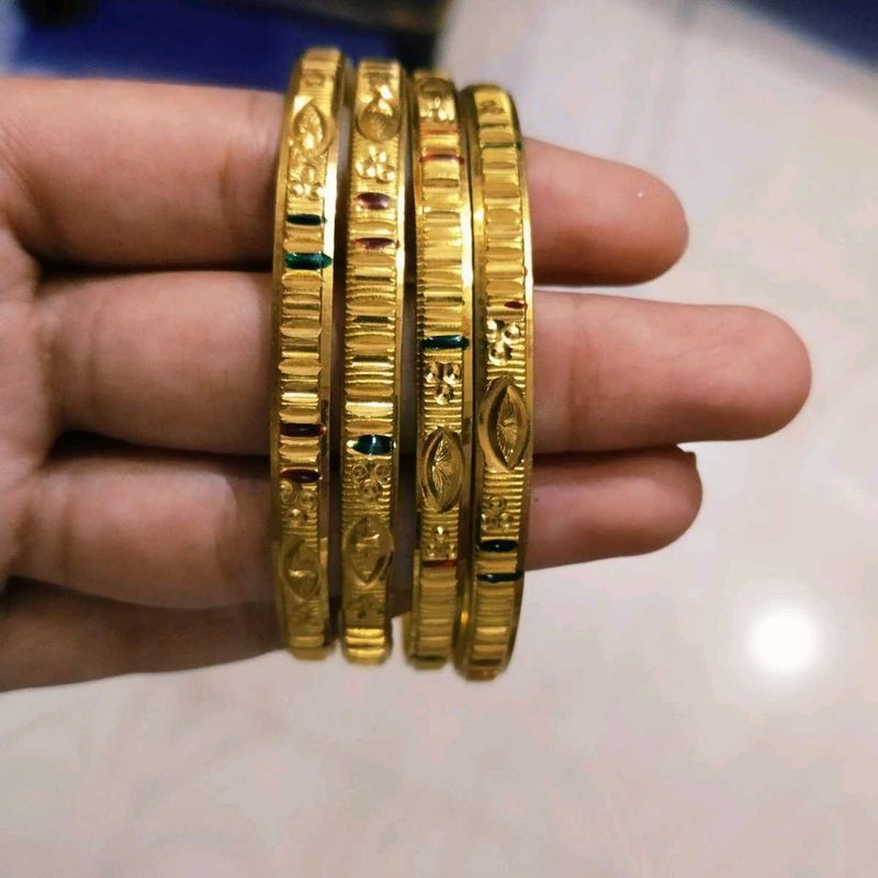 Set of Gold Bangles with Green Accents