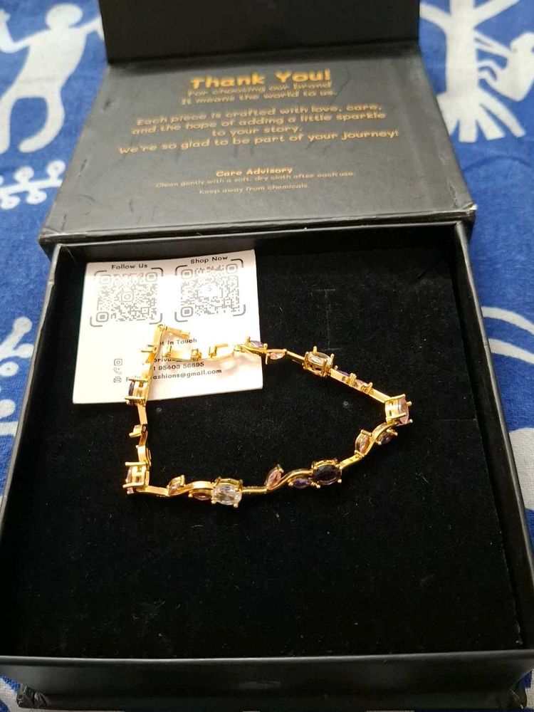 Elegant Gold-Tone Bracelet with Gems