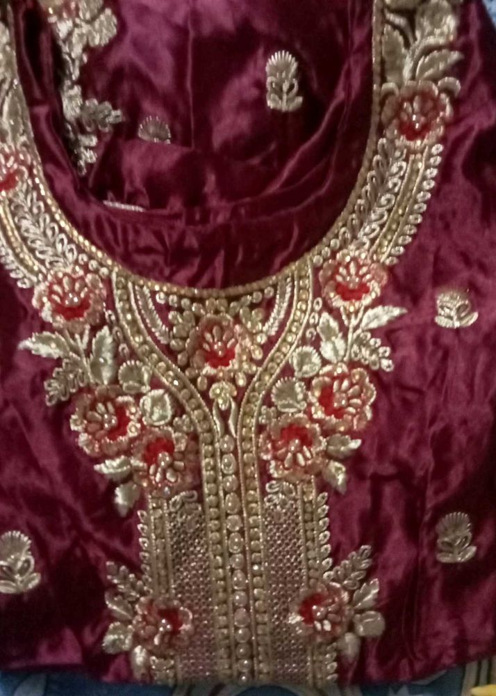 Embroidered suit new hai stitch kar wake rakhe ha