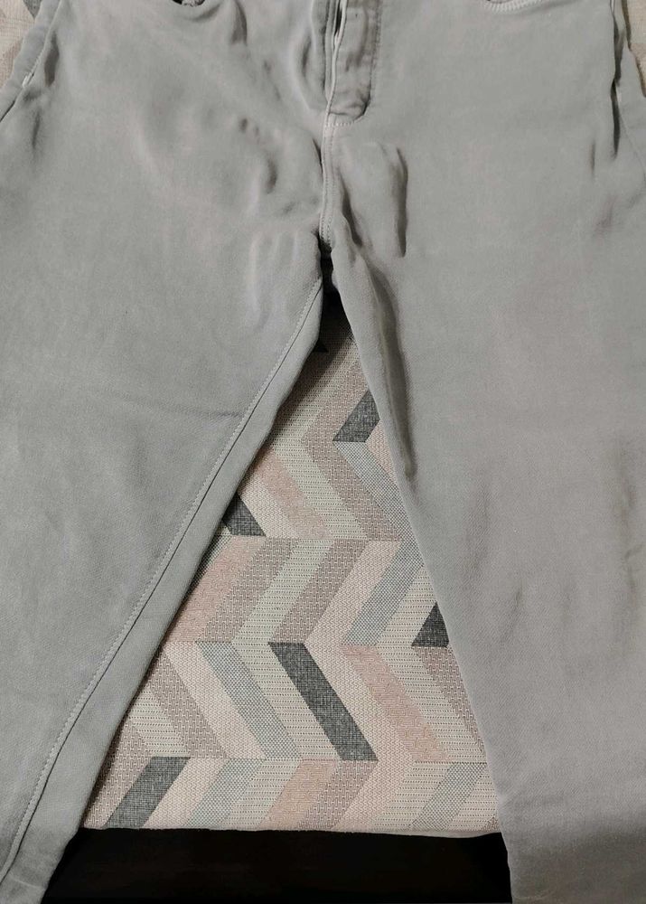 Grey women jeans with light green top