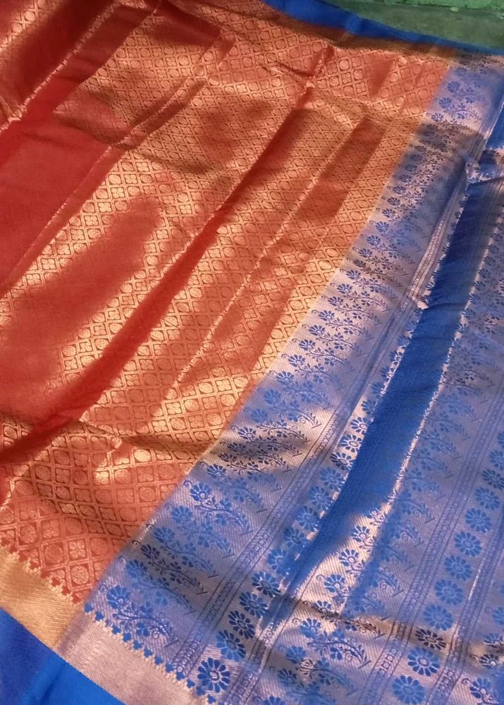 Brick orange saree with unstitched blouse