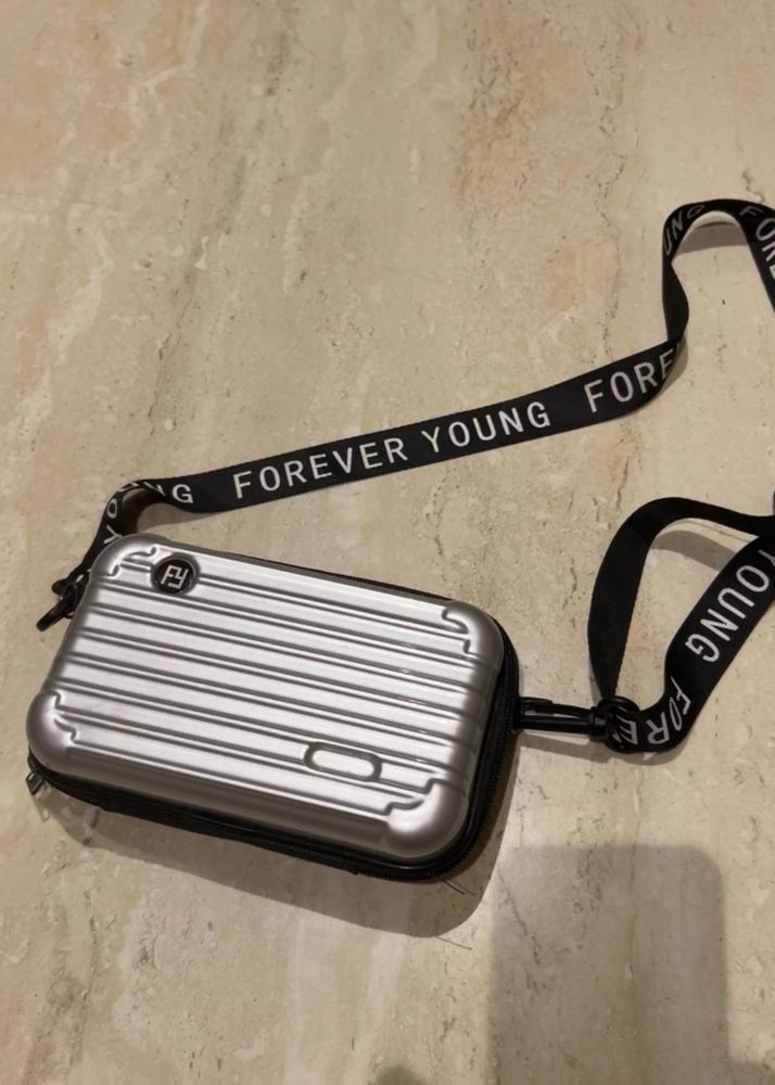 Convertible Silver Mini Luggage Style Clutch.