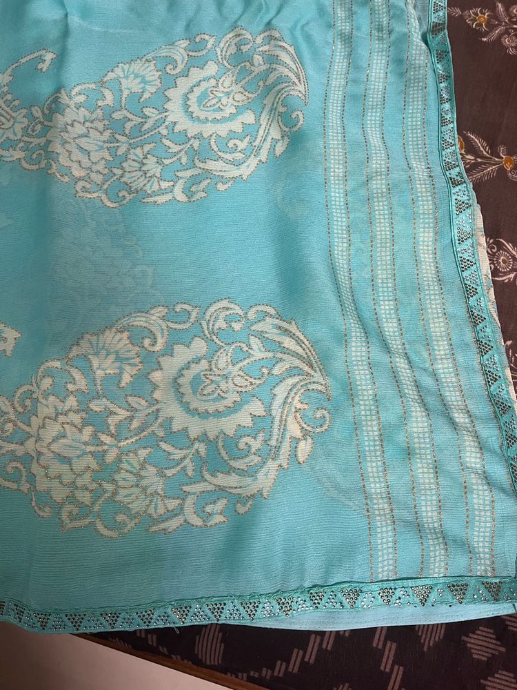 Elegant Teal Saree with Intricate Design