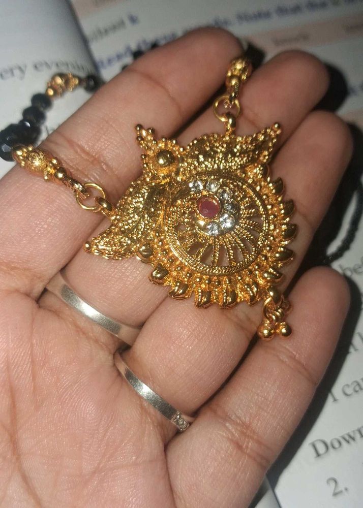 Mangalsutra. Exquisite Gold Necklace with Red Ston