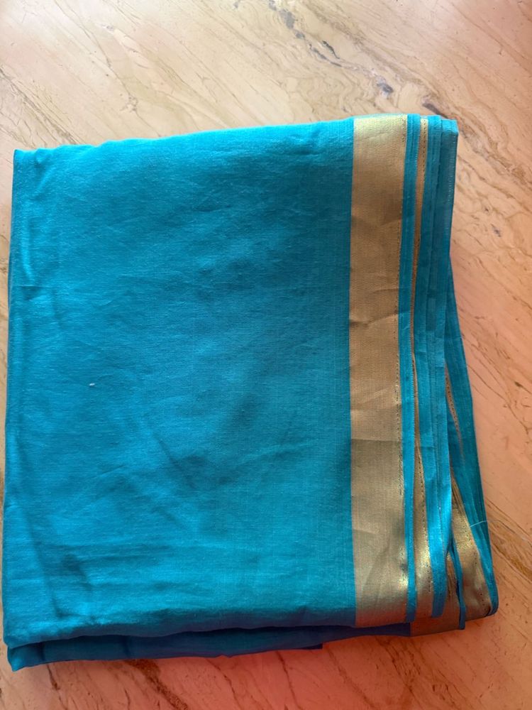 Beautiful Teal Saree with Gold Border
