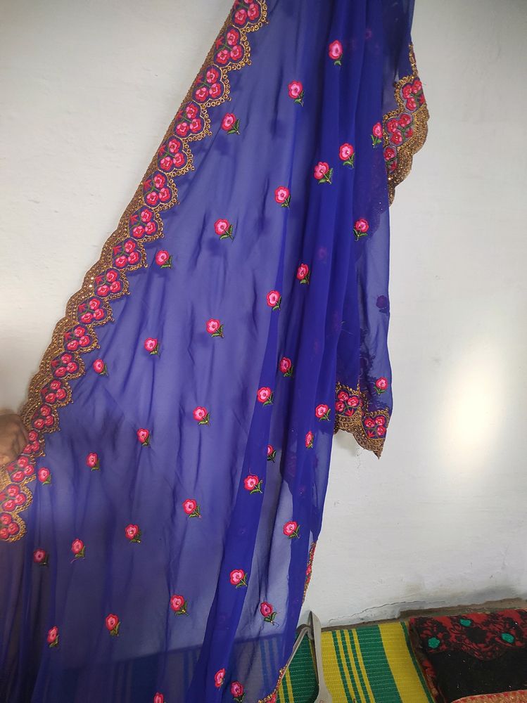 Blue Saree With Flowers Design