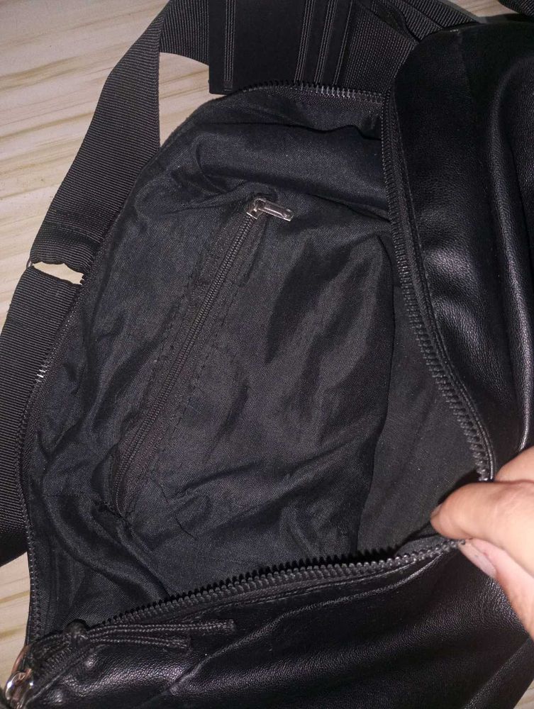 Black leather bag with adjustable strap