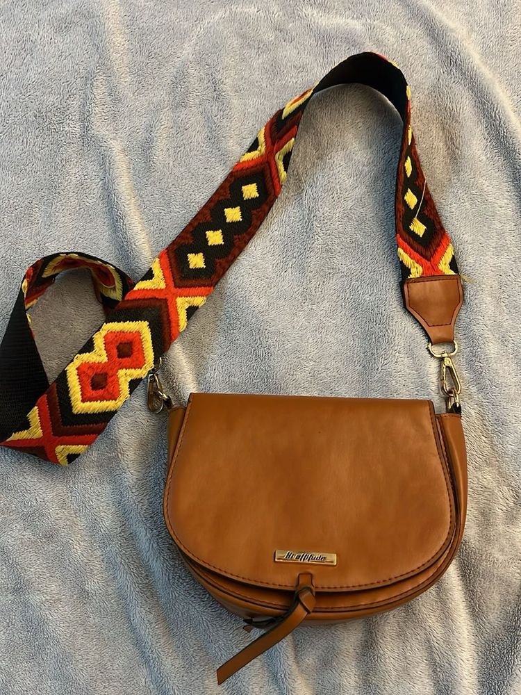 Stylish Brown Crossbody Bag with Embellished Strap