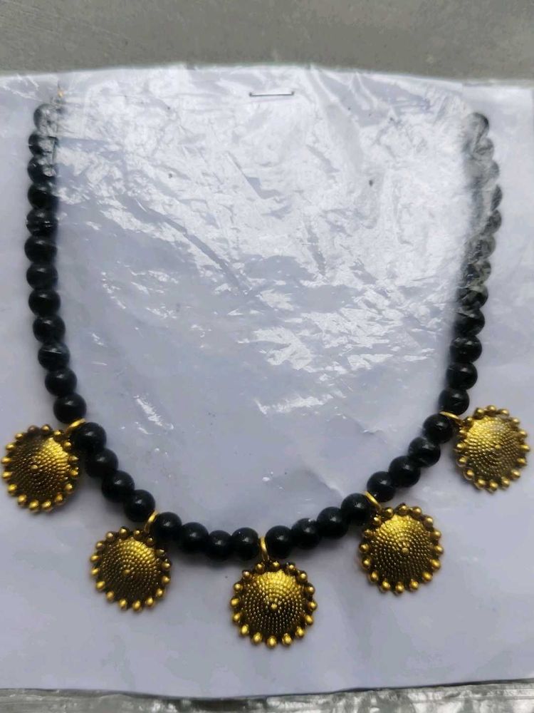 Black Beaded Necklace with Gold Pendants