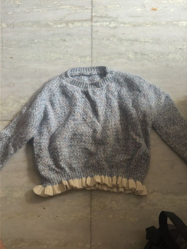 Cozy Knit Sweater with Ruffled Hem