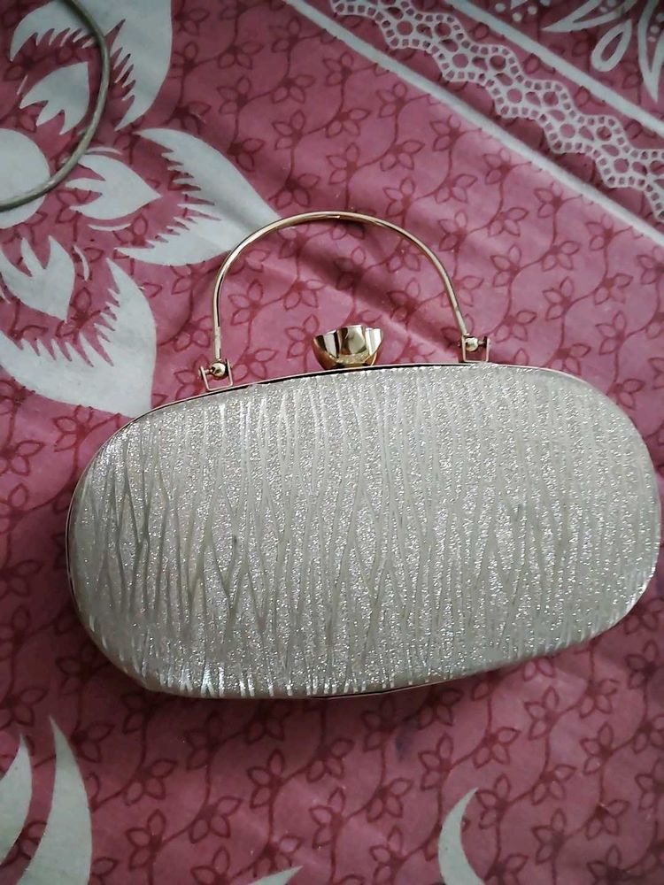 27.Sparkly Oval Clutch Bag