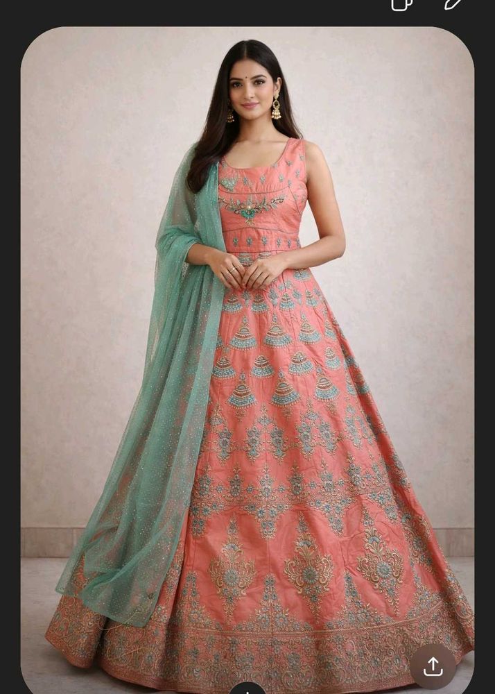 Ethnic peach gown with rich embroidery