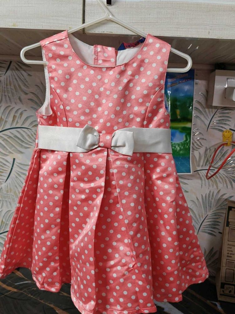 Cute peach Pink Polka Dot satin frock with Bow