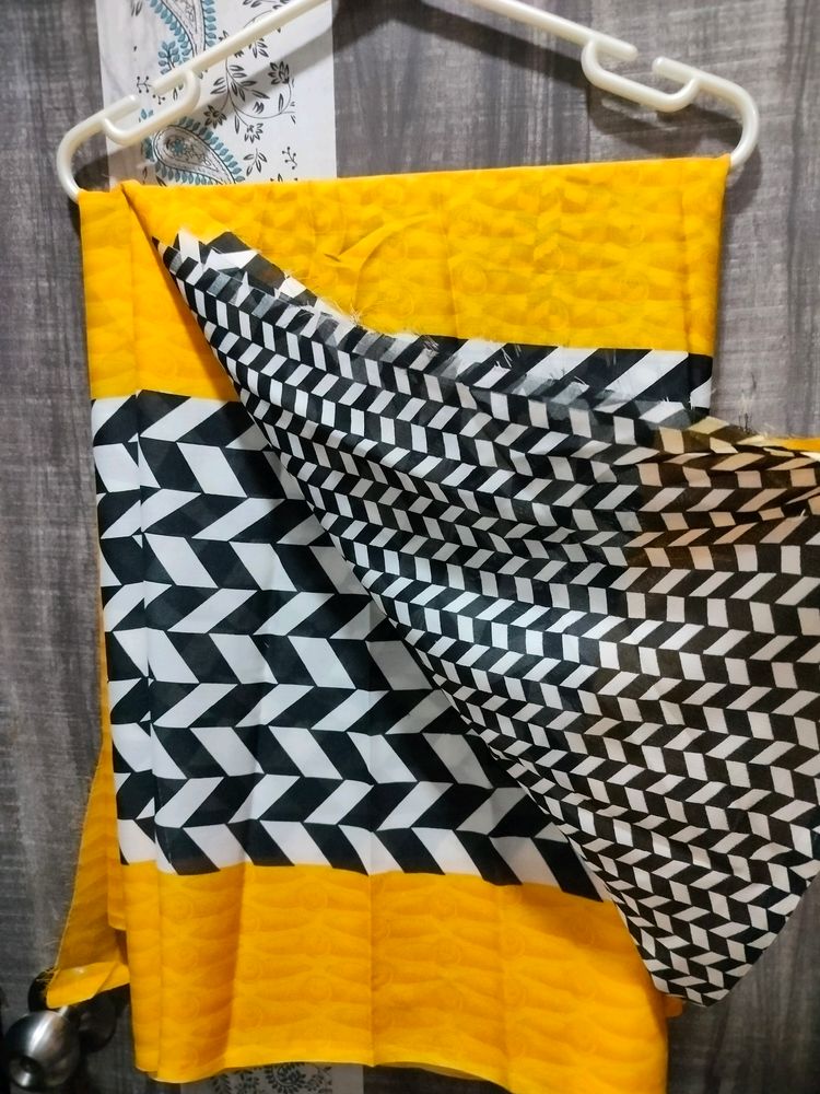 Yashika Yellow Black And White Georgette Saree With Blouse Piece