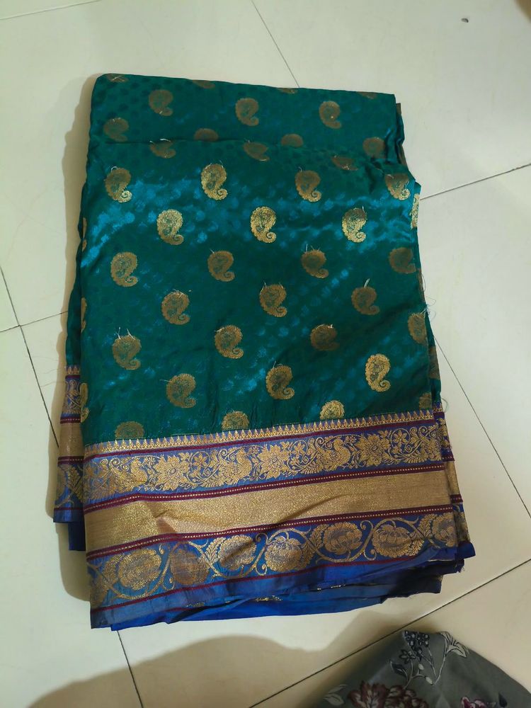 Elegant Teal Saree with Gold Paisley