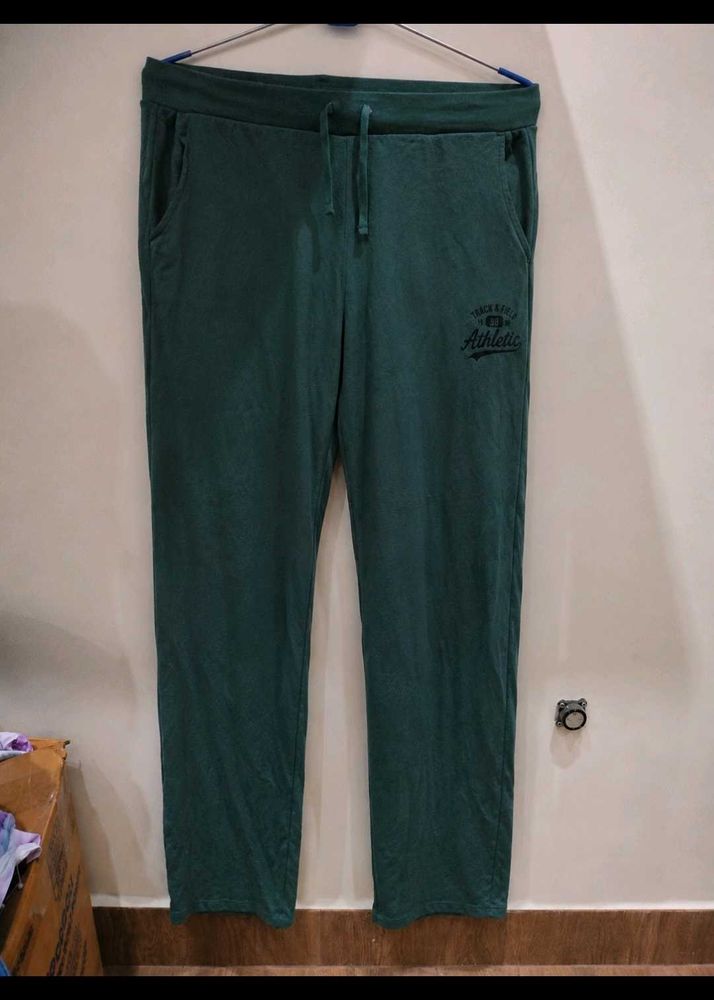 a green track pant