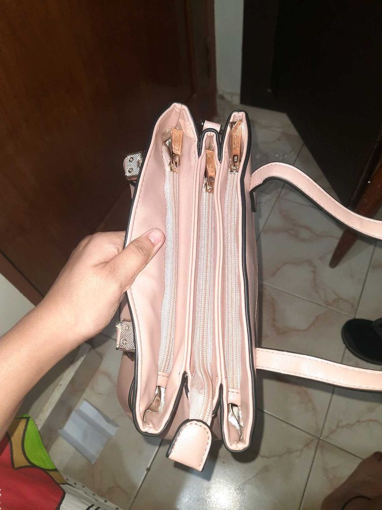 Stylish Pink Handbag with Multiple Compartments