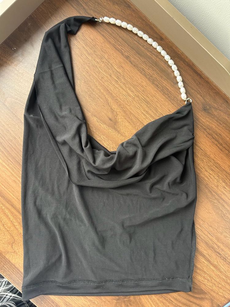Black backless halter neck top with pearls