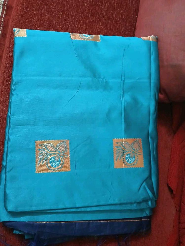 Beautiful Teal Saree with Gold Accents