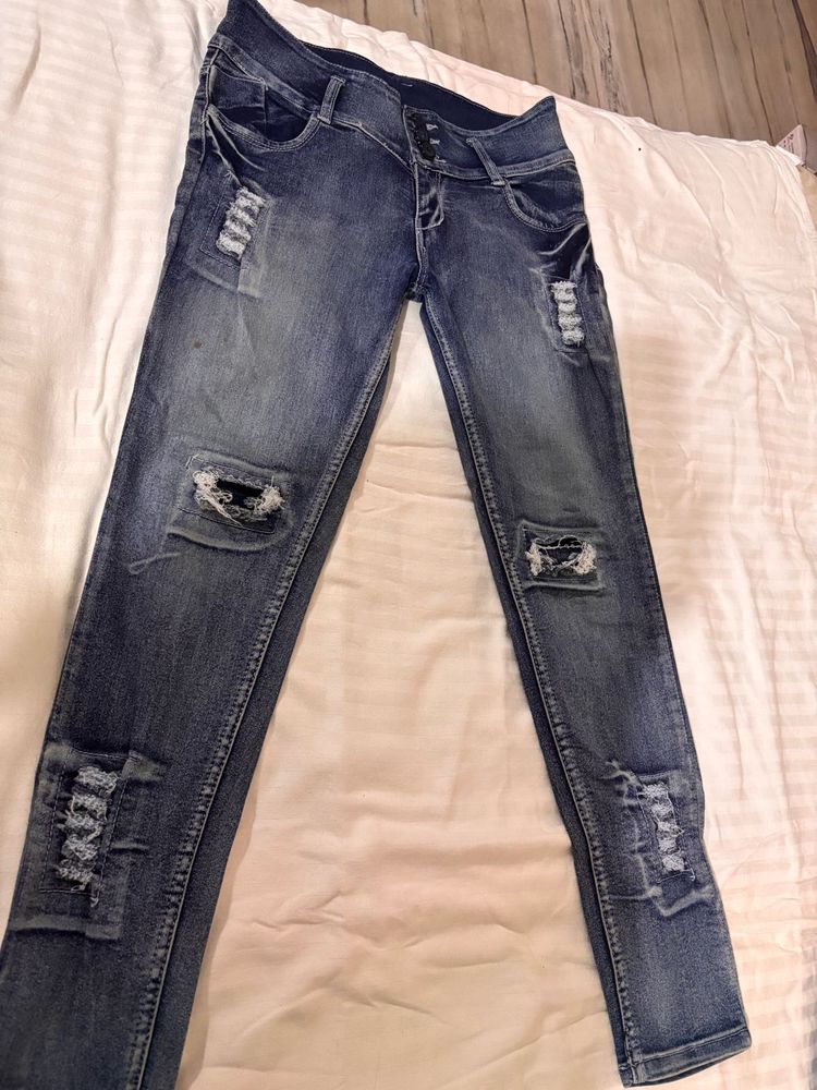 Distressed Blue Denim Jeans