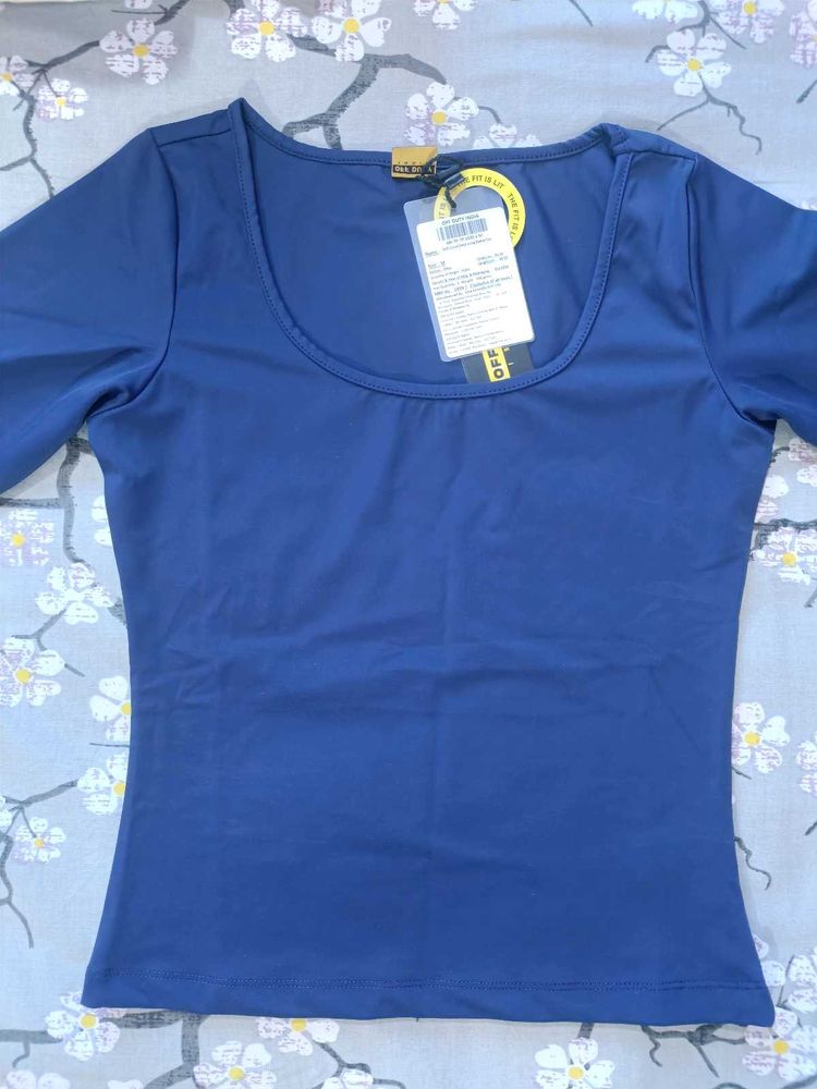 Blue fitted top and Brown mesh to