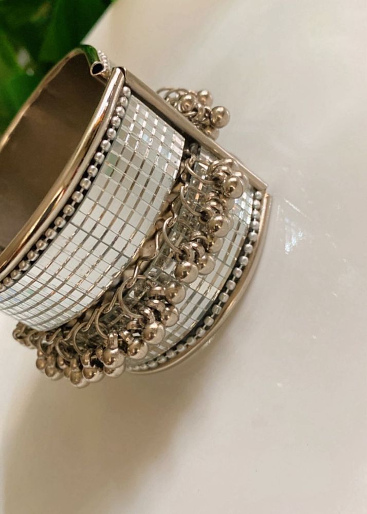 Elegant Silver Bangle with Tassels