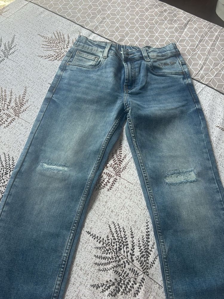 Distressed Blue Denim Jeans