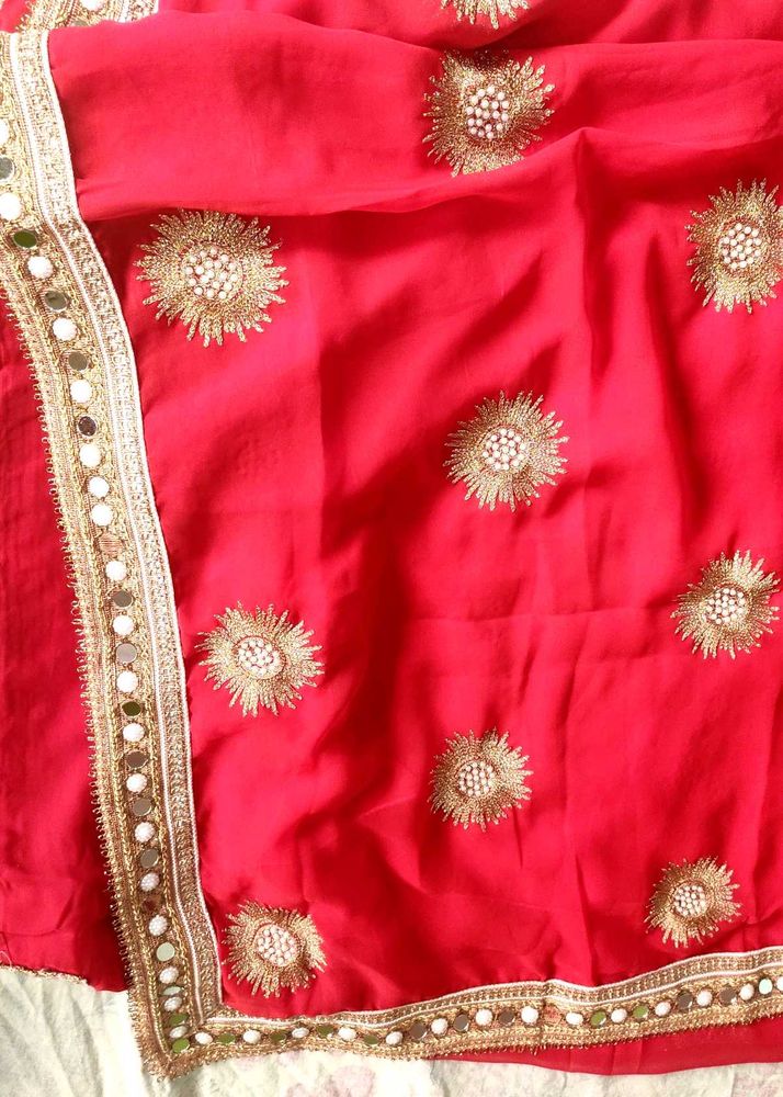 Red saree with mirror work border