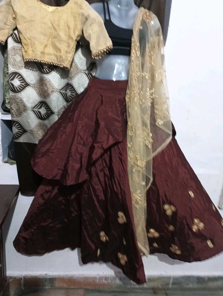 dark brown lehga with golden duppatta and blouse