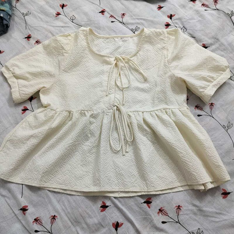 Cream Textured Peplum Top