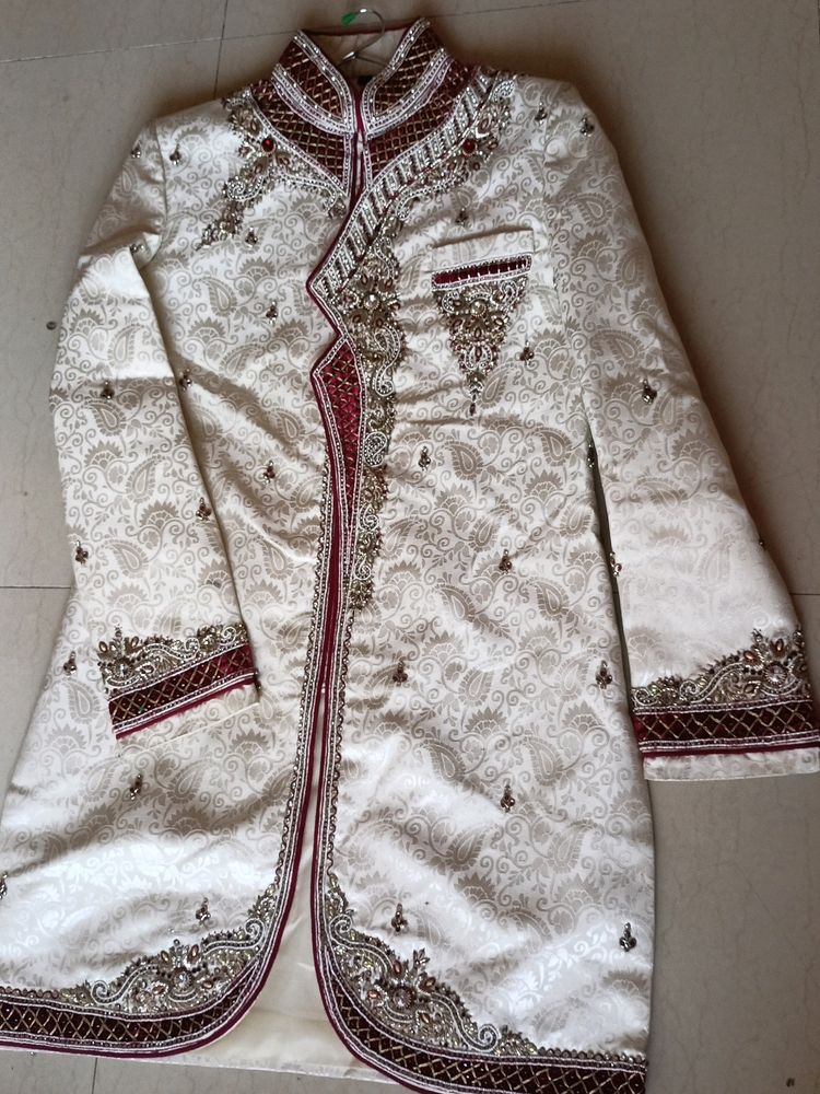 Heavy handwork ivory sherwani, for wedding functions..