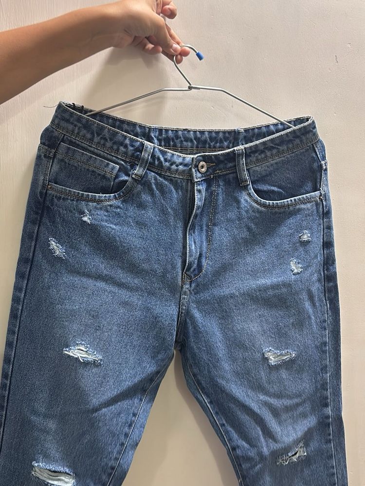 Distressed Blue Denim Jeans