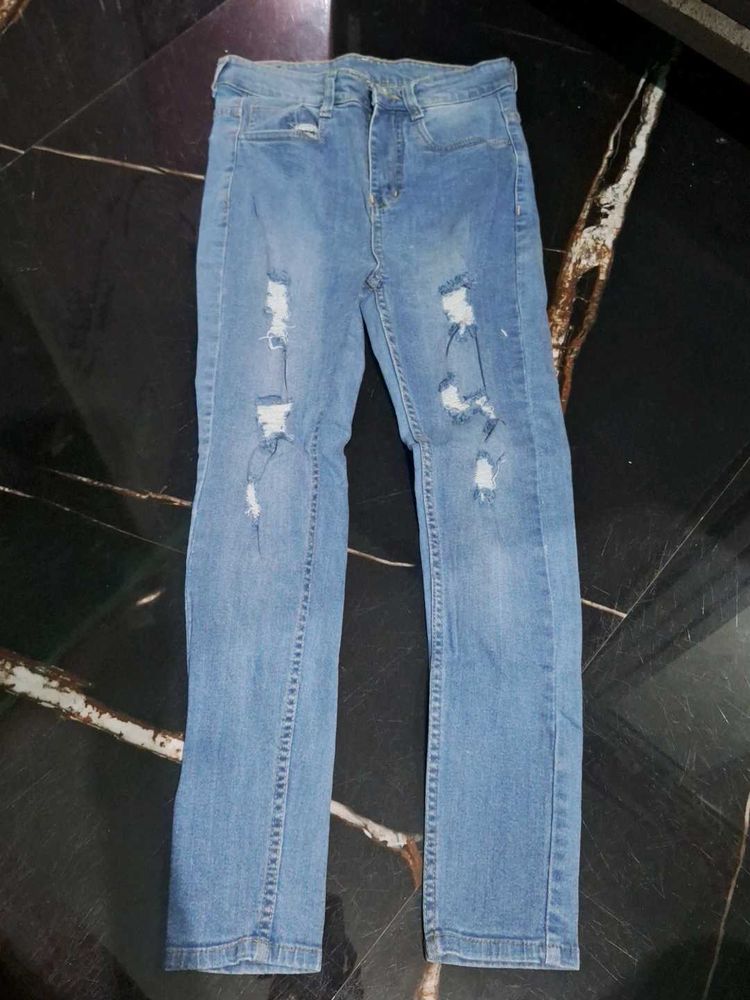 Ripped Light Wash Denim Jeans
