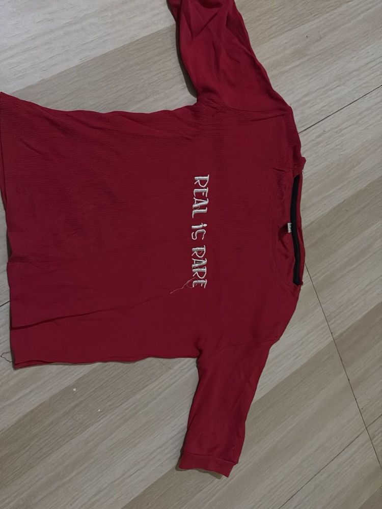 Red T-Shirt with "Real is Rare" slogan