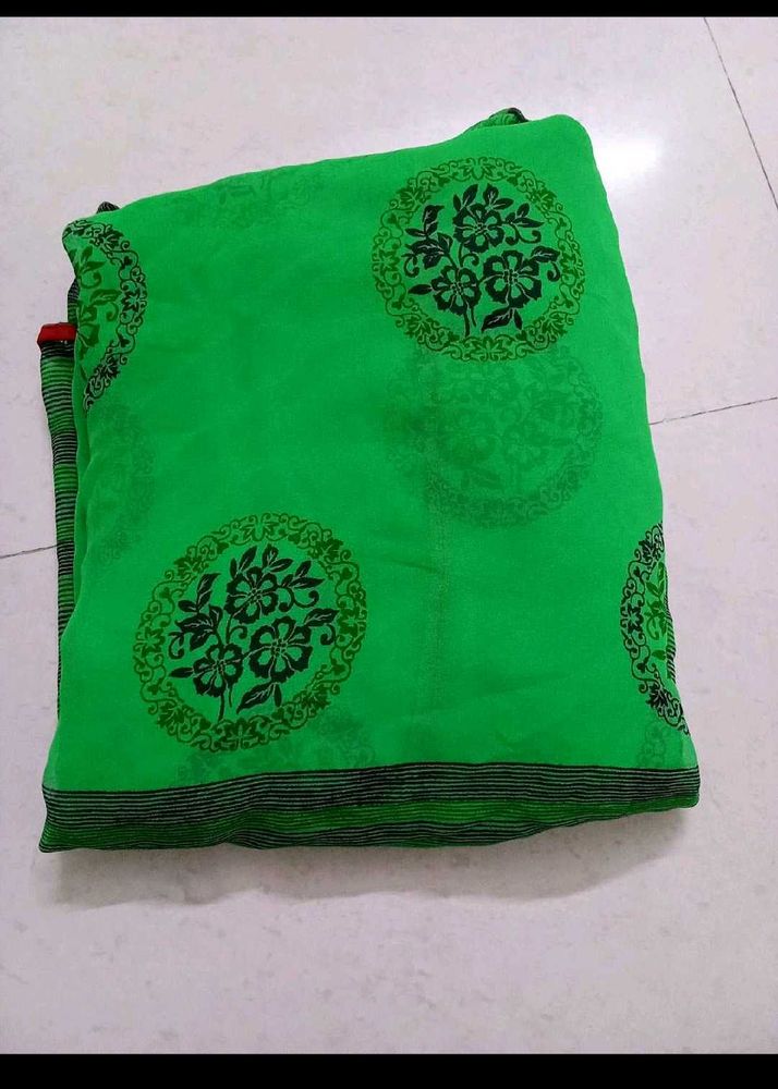 Vibrant Green Saree with Black Floral Motifs