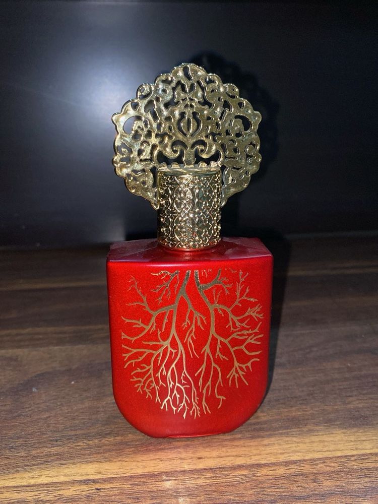Unique Red Perfume Bottle with Ornate Cap