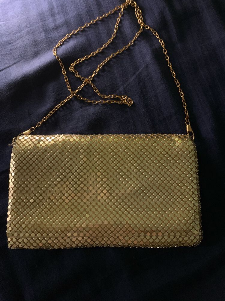Gold metal mesh clutch