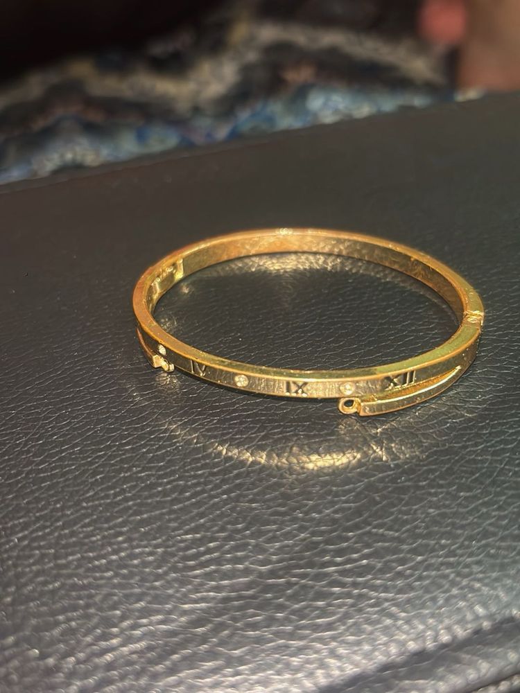 Elegant Gold Bangle with Roman Numerals