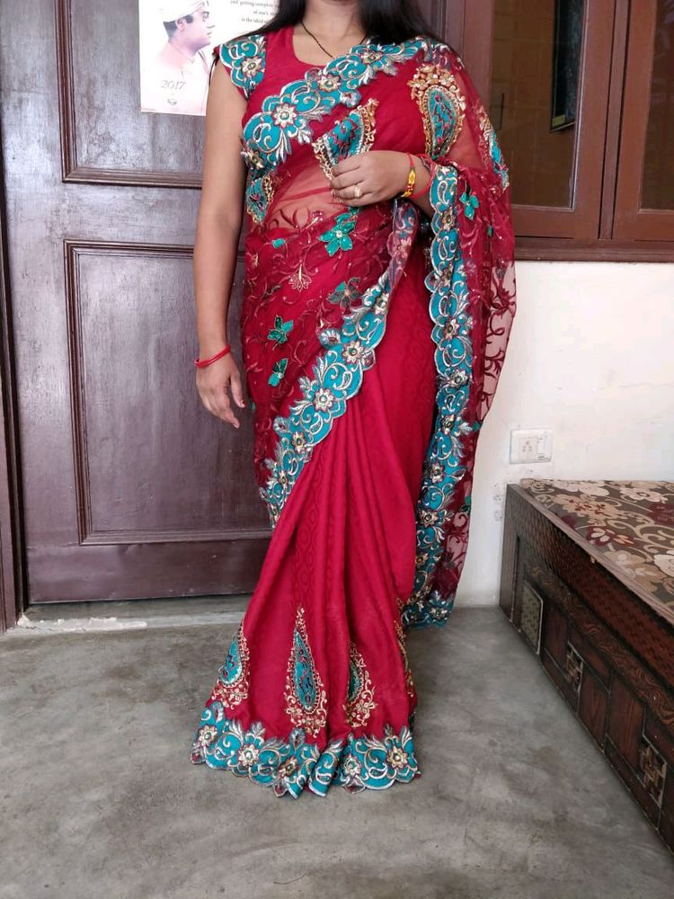 maroon color net saree with stiched blouse